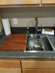 Kitchen sink with cutting board